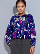 Model wearing Yahweh Statement Cropped Hoodie with abstract purple print, showcasing urban elegance and bold gothic typography.