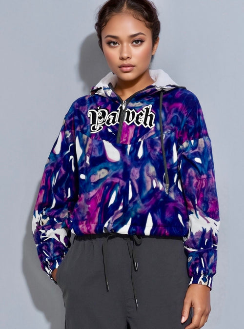 Model wearing Yahweh Statement Cropped Hoodie with abstract purple print, showcasing urban elegance and bold gothic typography.