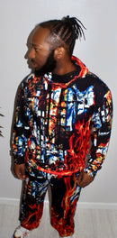 Model wearing the bold Divine Fire Men’s Hoodie with vibrant print, showcasing urban sophistication and style.