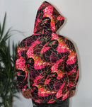 Back view of the Crimson Peacock Mosaic Men’s Hoodie featuring vibrant pink, red, and black geometric patterns.
