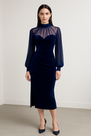 Elegant midnight navy velvet gown with sheer mesh yoke and bishop sleeves, featuring a sweetheart bodice and front slit.