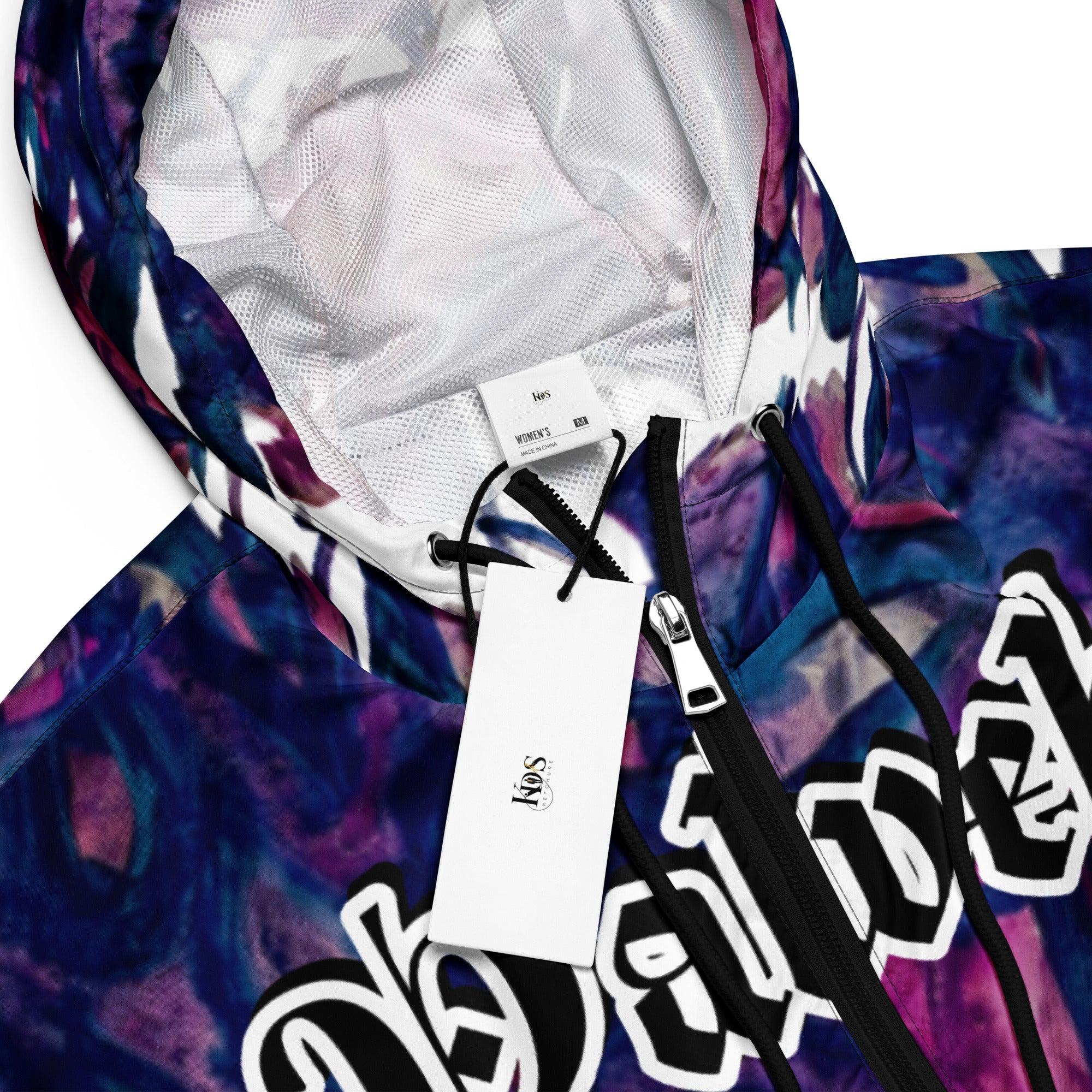 Model wearing Yahweh Statement Cropped Hoodie with abstract purple print, showcasing urban elegance and bold gothic typography.